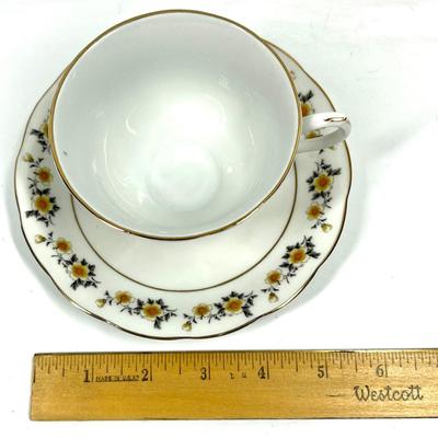 Flower patterned tea cup and saucer
