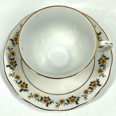 Flower patterned tea cup and saucer