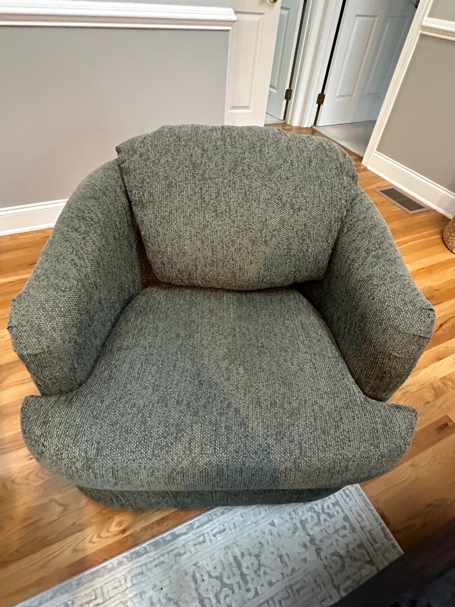 Two greenish grey swivel club chairs