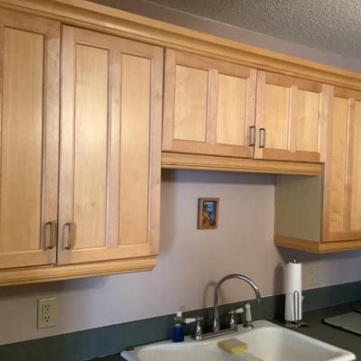 Cabinetry over sink with crown molding