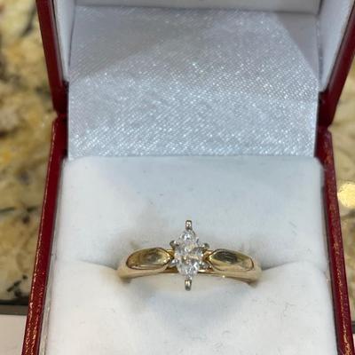 14kt gold with platinum head and marquise cut diamond comes with appraisal