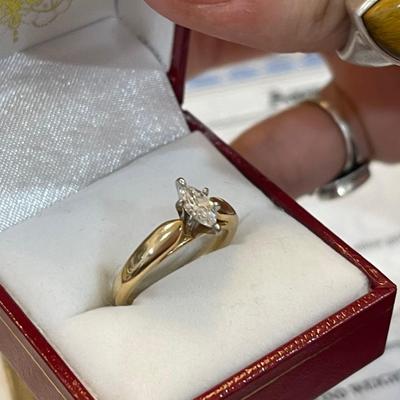 14kt gold with platinum head and marquise cut diamond comes with appraisal