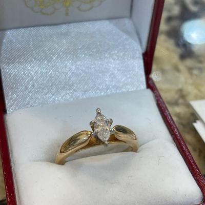 14kt gold with platinum head and marquise cut diamond comes with appraisal