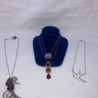 4 necklaces including a necklace watch by Gruen