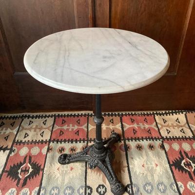 Marble top cafe table with a cast iron base