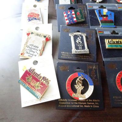 LOT 205. COLLECTION OF ATLANTA OLYMPIC PINS AND HAT
