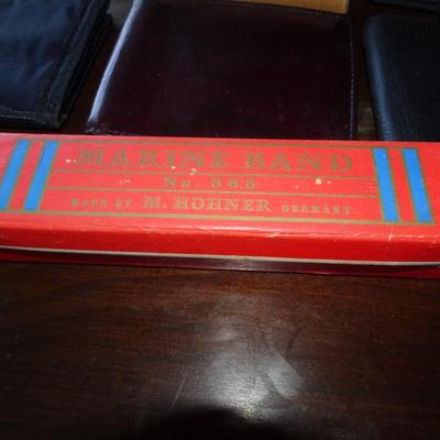 LOT 207. MARINE BAND HORNER  HARMONICA AND SIX USED WALLETS