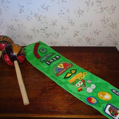 LOT 247. VINTAGE GIRL SCOUT SASH AND TWO MARACAS