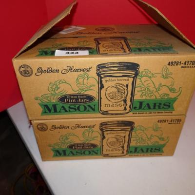 LOT 333. TWO BOXES OF UNUSED MASON JARS WITH LIDS
