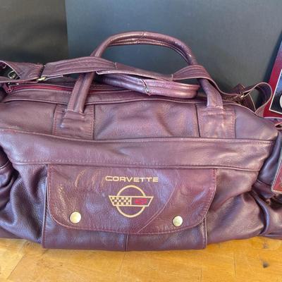 Lot 41-A. Corvette Leather Duffel Bag & Metal Poster