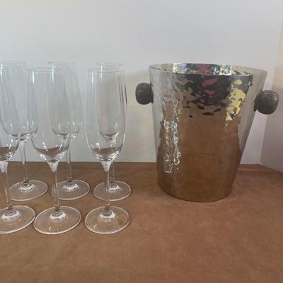 Lot 161. Hammered Metal Ice Bucket and Champagne Flutes