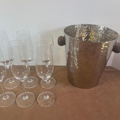 Lot 161. Hammered Metal Ice Bucket and Champagne Flutes