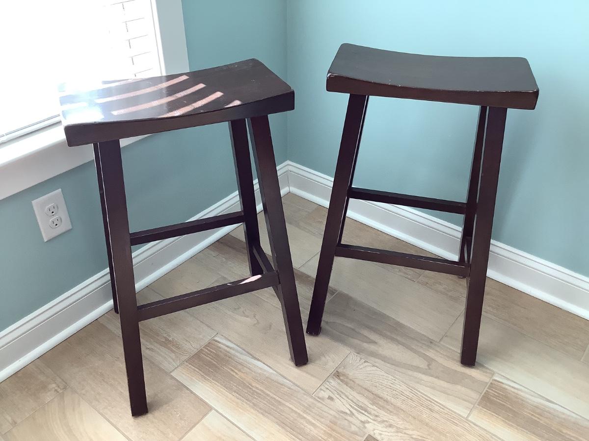 2 wooden bar stools, darker brown, 1 rung, 29”H, 17 1/2”x9”seat, base