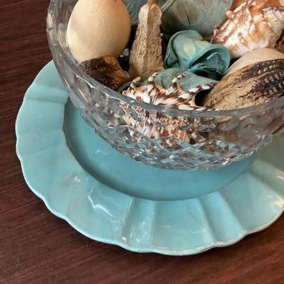 Light blue charger with glass bowl, and decor