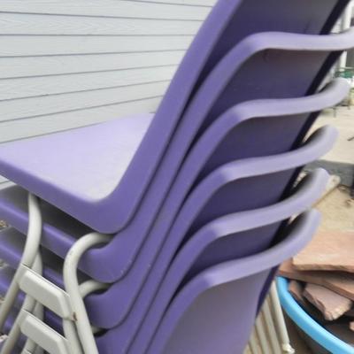 FOUR STACKABLE PURPLE CHAIRS