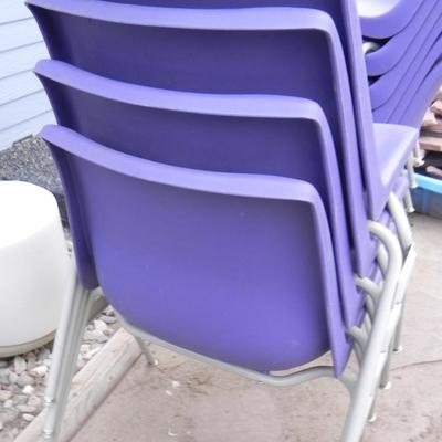 FOUR STACKABLE PURPLE CHAIRS