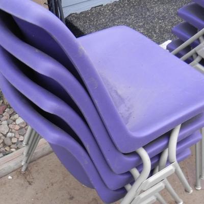 FOUR STACKABLE PURPLE CHAIRS