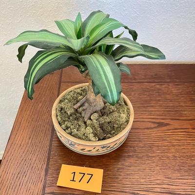 Fake flower arrangement in clay pot