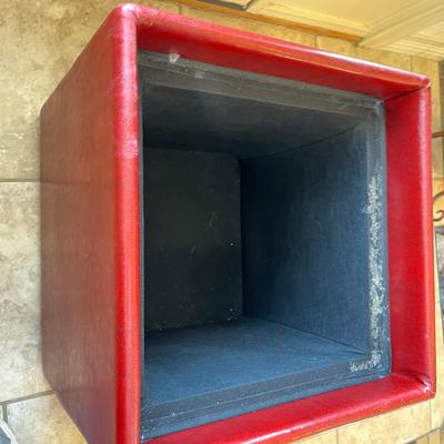 Red vinyl storage stool