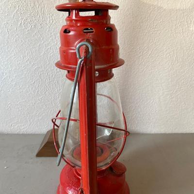 Red metal and glass oil lantern
