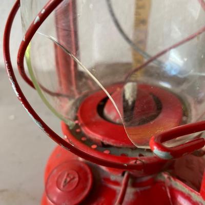 Red metal and glass oil lantern