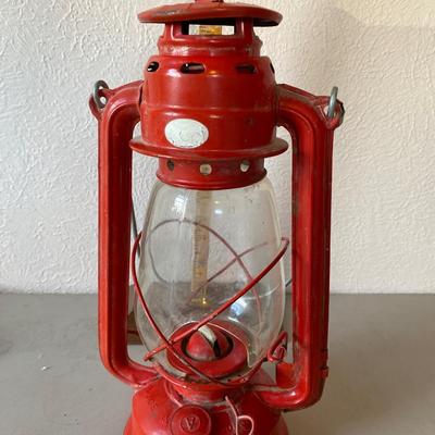 Red metal and glass oil lantern