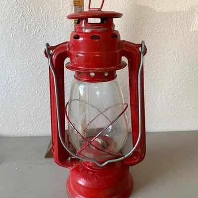 Red metal and glass oil lantern
