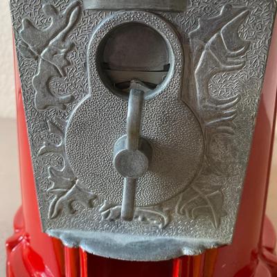 Vintage metal and glass gumball machine