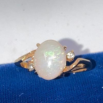 Suite of 10K gold rings and a bracelet with opal and white stone.