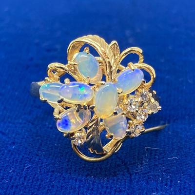 Suite of 10K gold rings and a bracelet with opal and white stone.
