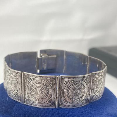 Sterling Silver Aztec Calendar, hinged bracelet. 26.78 grams.
