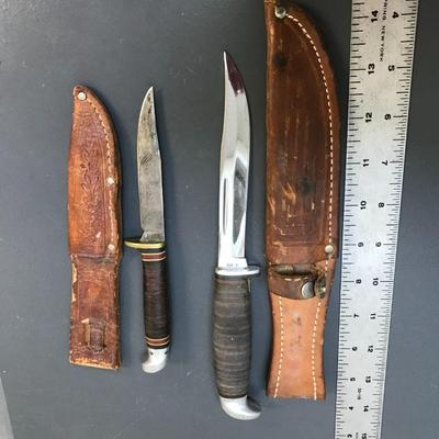 Knives with leather sheaths
