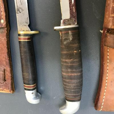 Knives with leather sheaths