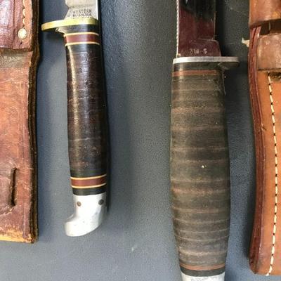 Knives with leather sheaths
