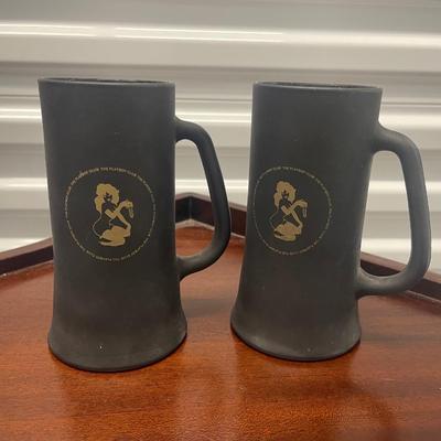 Vintage 2 black glass Playboy Club mugs. 6-1/2” tall