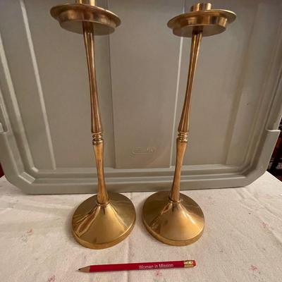 Pair of tall brass candlesticks