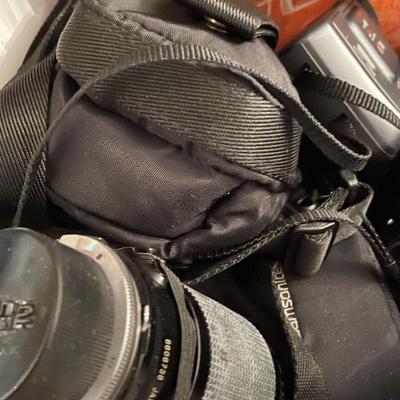 Box of cameras, lenses, bags