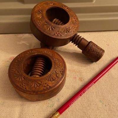 2 carved wooden nut crackers