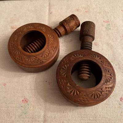 2 carved wooden nut crackers
