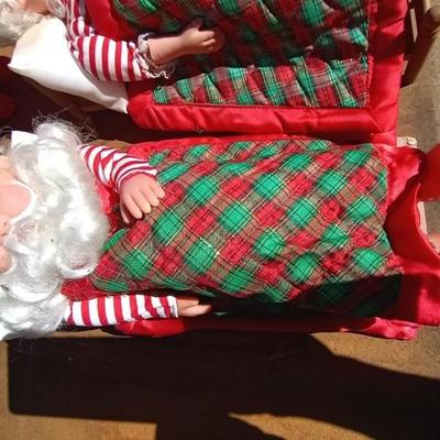 SLEEPING MR & MRS CLAUSE AND BOTH ON BENCH