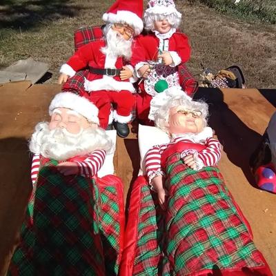SLEEPING MR & MRS CLAUSE AND BOTH ON BENCH