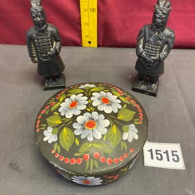 Statues and covered bowl