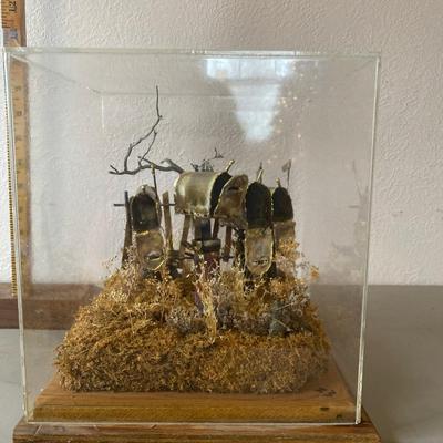 Tin sculpture of mailboxes in protective case
