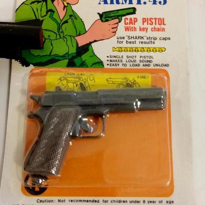 LOT 85  TWO TOY CAP GUNS WITH CAPS