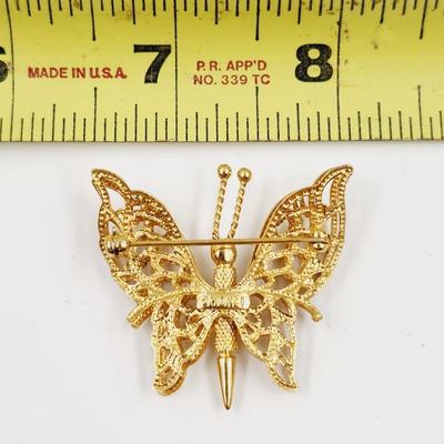 VINTAGE MONET GOLD TONED DOUBLE WINGED BROOCH