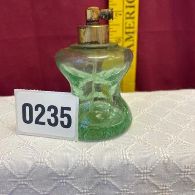 Green glass perfume bottle