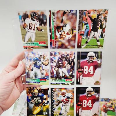 234 COLLECTABLE FOOTBALL CARDS IN PROTECTIVE SLEEVES - ROOKIES INCLUDED