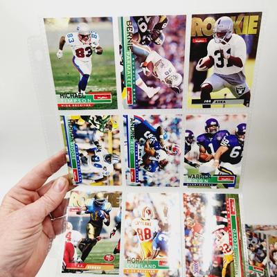 234 COLLECTABLE FOOTBALL CARDS IN PROTECTIVE SLEEVES - ROOKIES INCLUDED