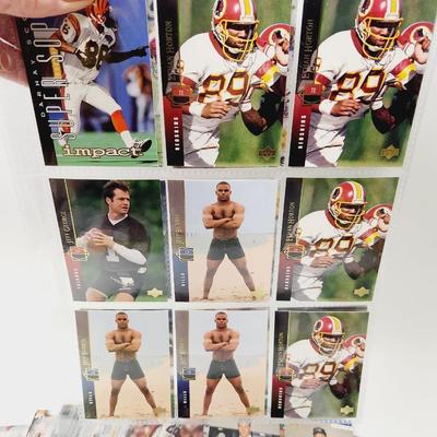 234 COLLECTABLE FOOTBALL CARDS IN PROTECTIVE SLEEVES - ROOKIES INCLUDED