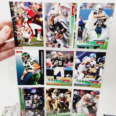 234 COLLECTABLE FOOTBALL CARDS IN PROTECTIVE SLEEVES - ROOKIES INCLUDED